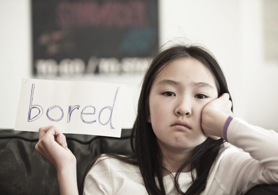 little girl holding a sign
